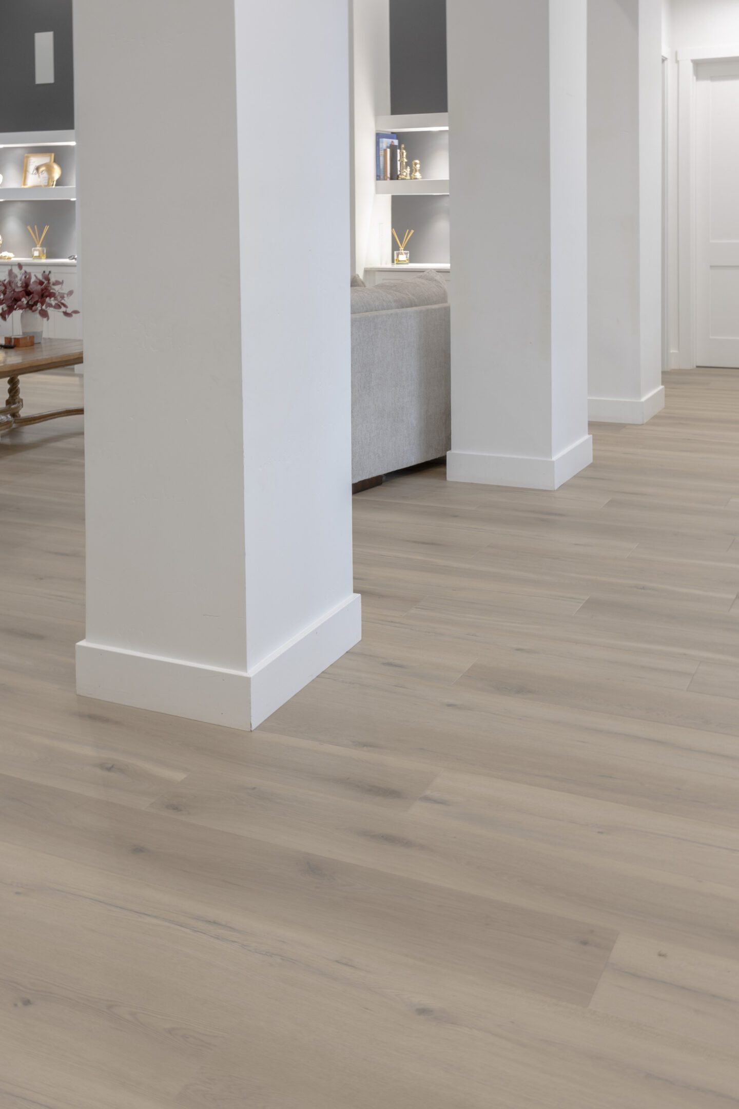 A room with white walls and wooden floors.