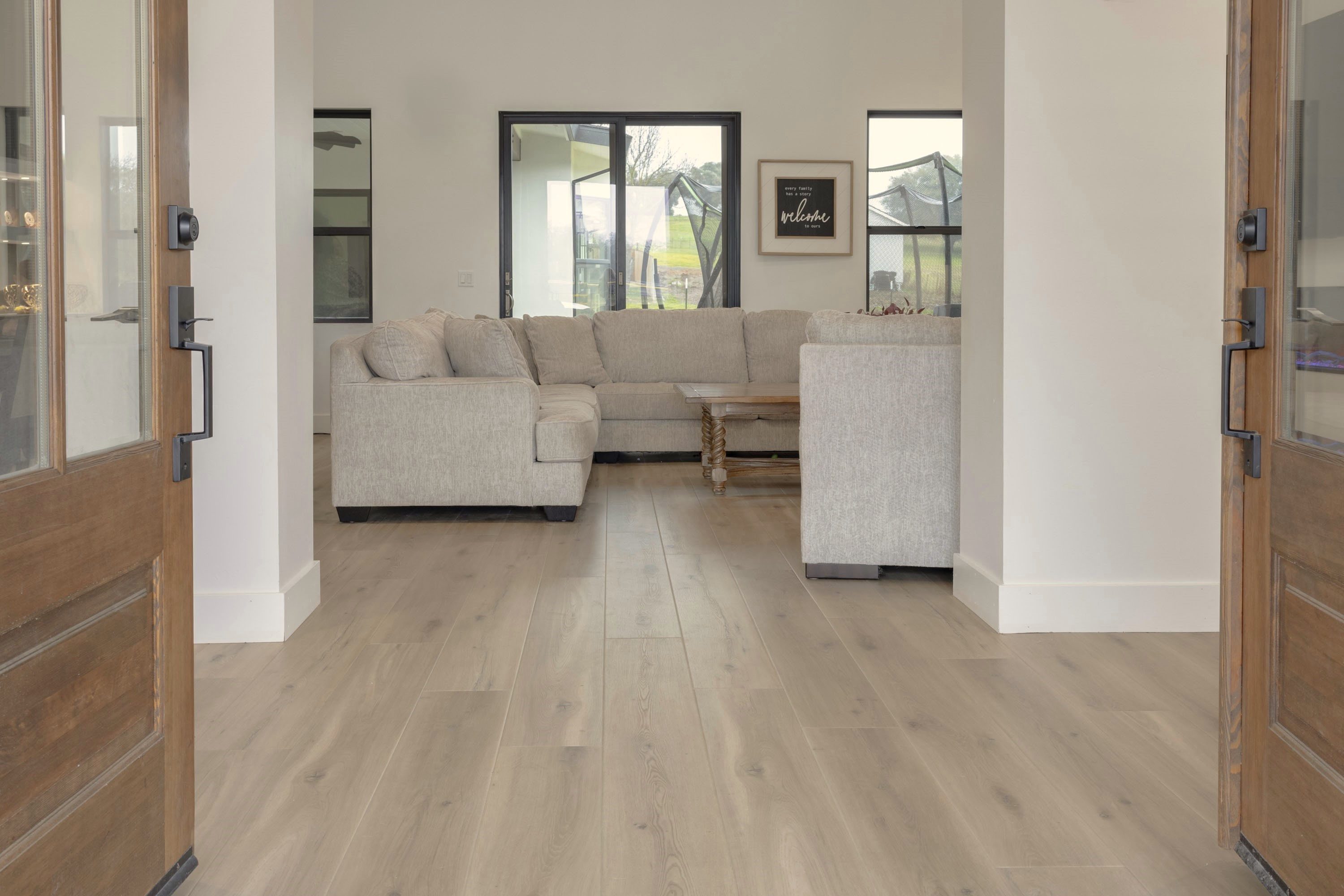 A living room with white walls and floors